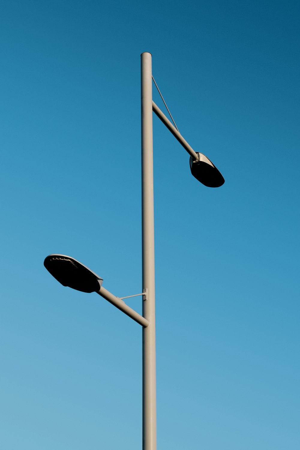 a street light with a blue sky in the background