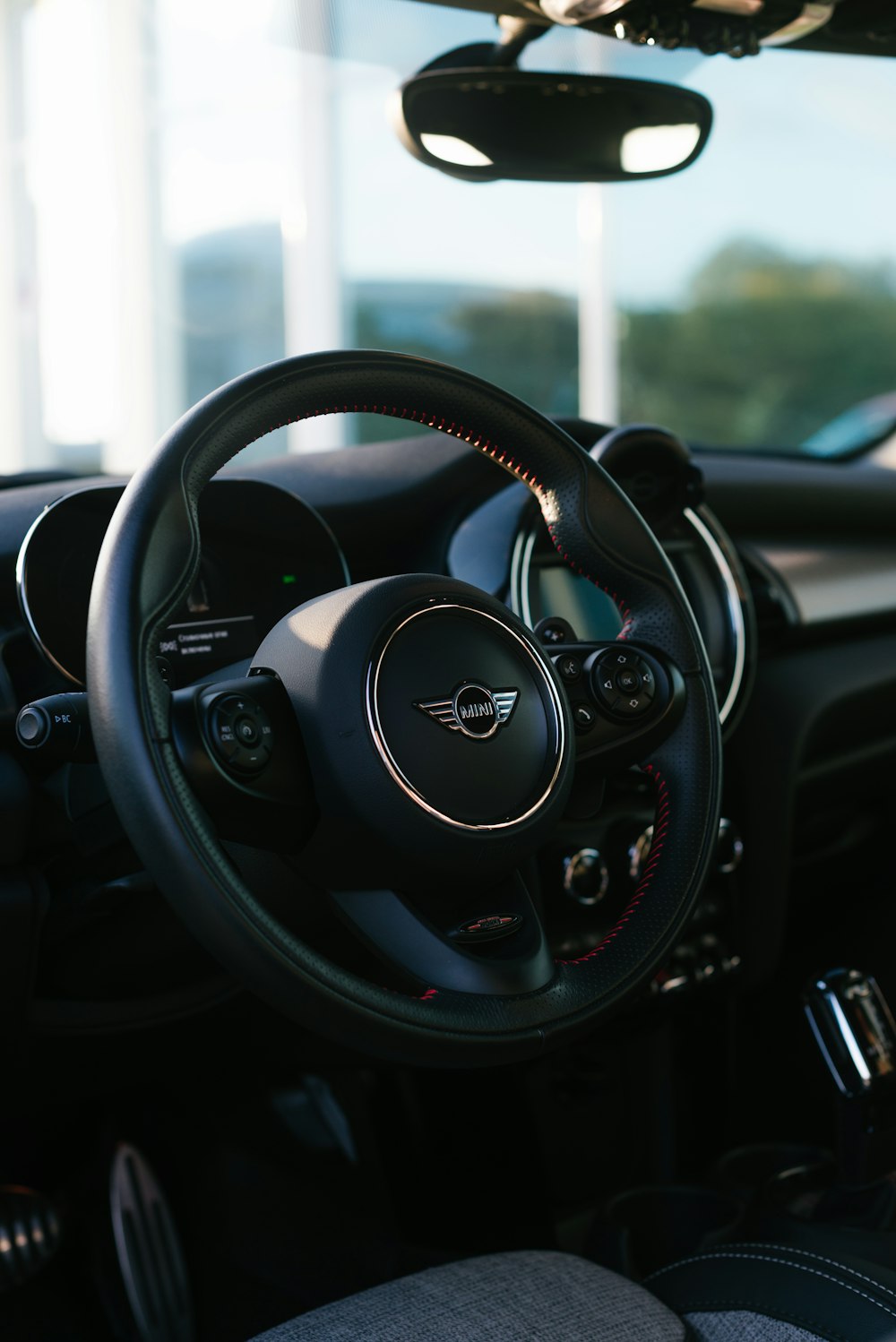 the interior of a car with a steering wheel