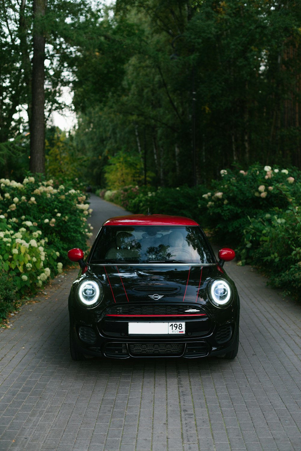 a red car parked on the side of a road