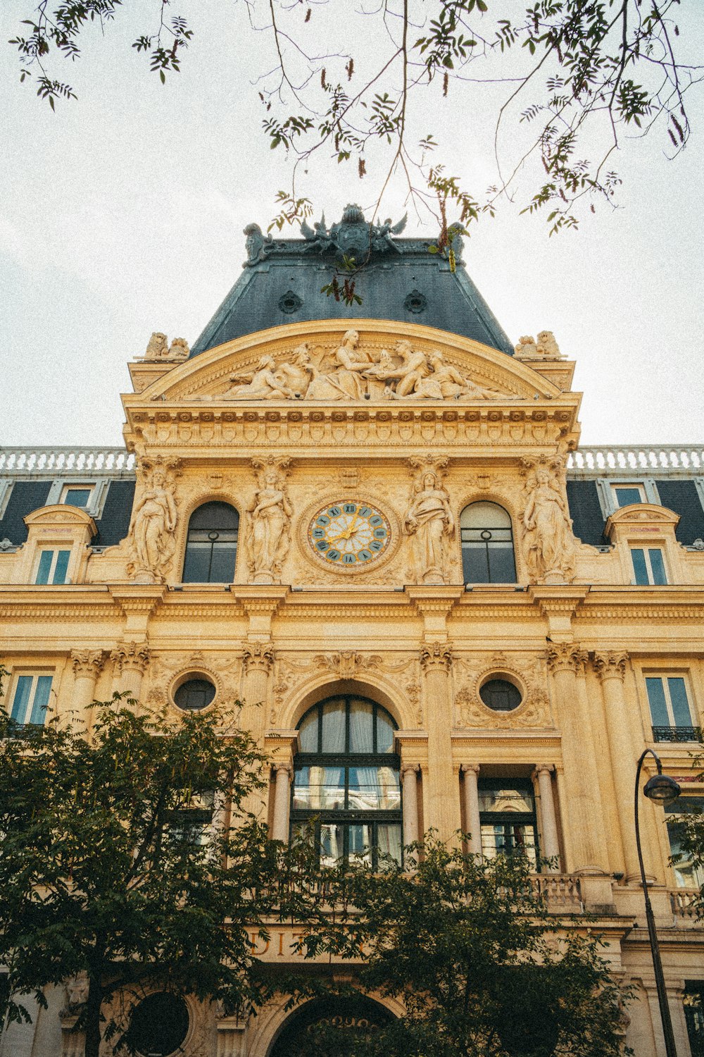 a large building with a clock on the top of it