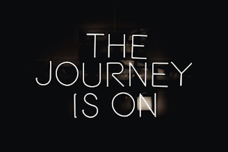 a black and white photo with the words the journey is on