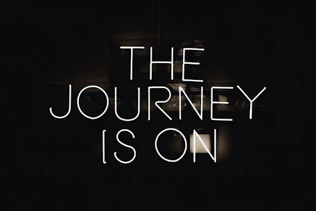 a black and white photo with the words the journey is on