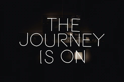 a black and white photo with the words the journey is on