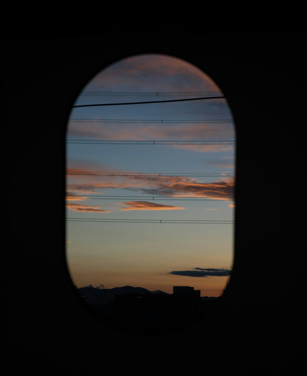 a view of a sunset through an airplane window
