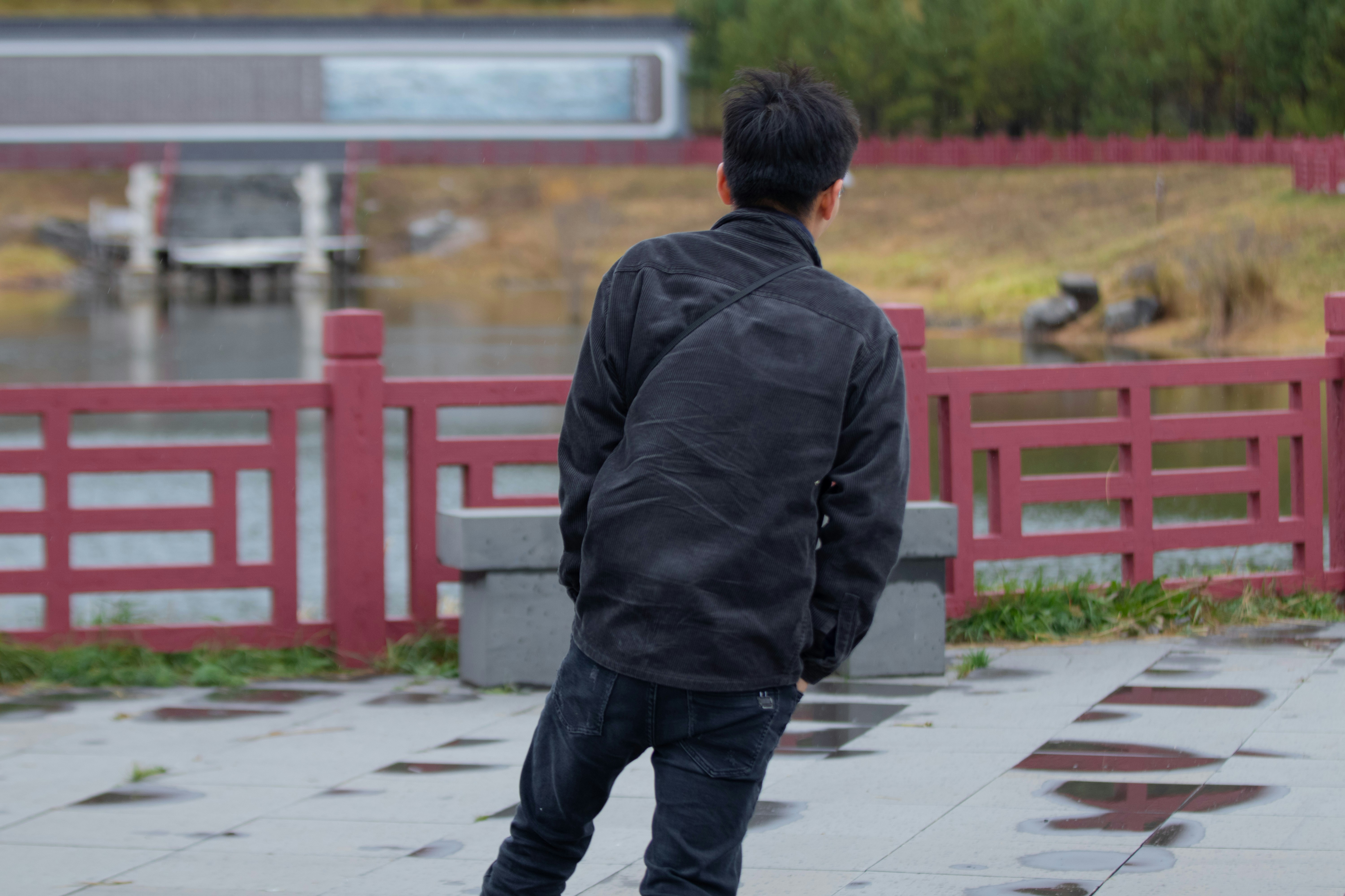a man riding a skateboard down a sidewalk