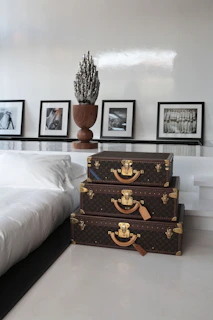 a couple of suitcases sitting on top of a white floor
