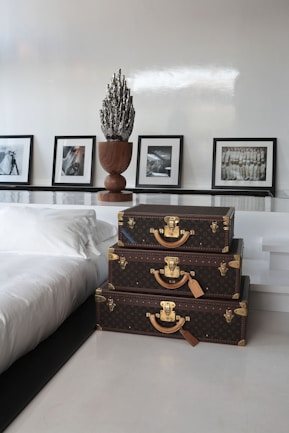a couple of suitcases sitting on top of a white floor
