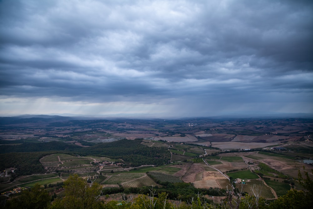 a view of the countryside from the top of a hill