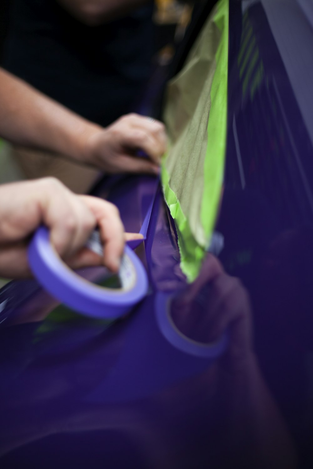 a person using a pair of scissors to cut a piece of paper