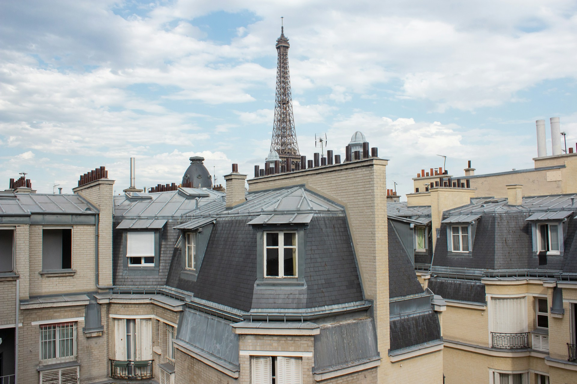 a view of the eiffel tower from the roof of a building