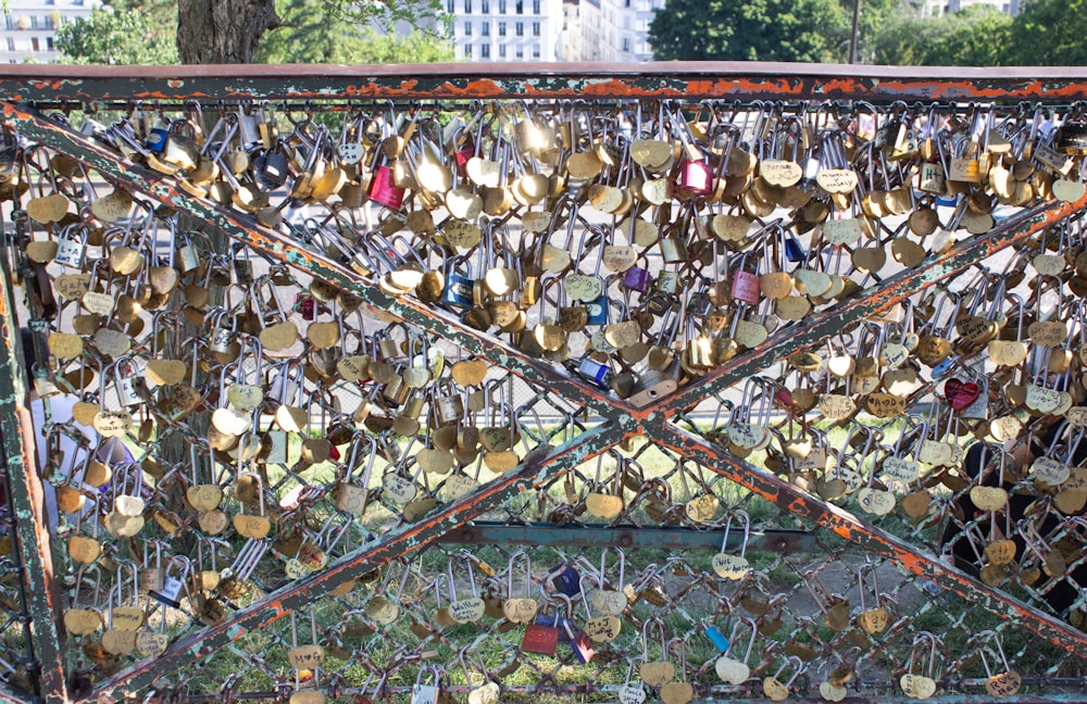 a fence covered in lots of different types of buttons