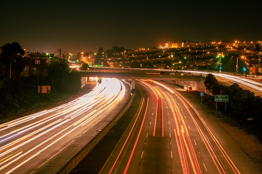 a city street filled with lots of traffic at night