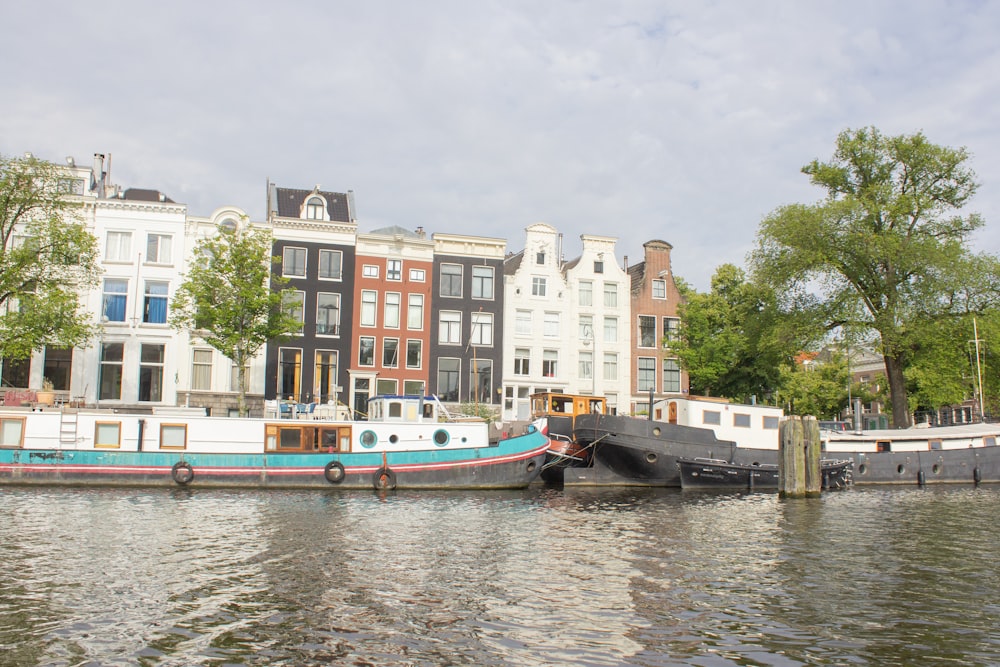 a blue and white boat in a body of water