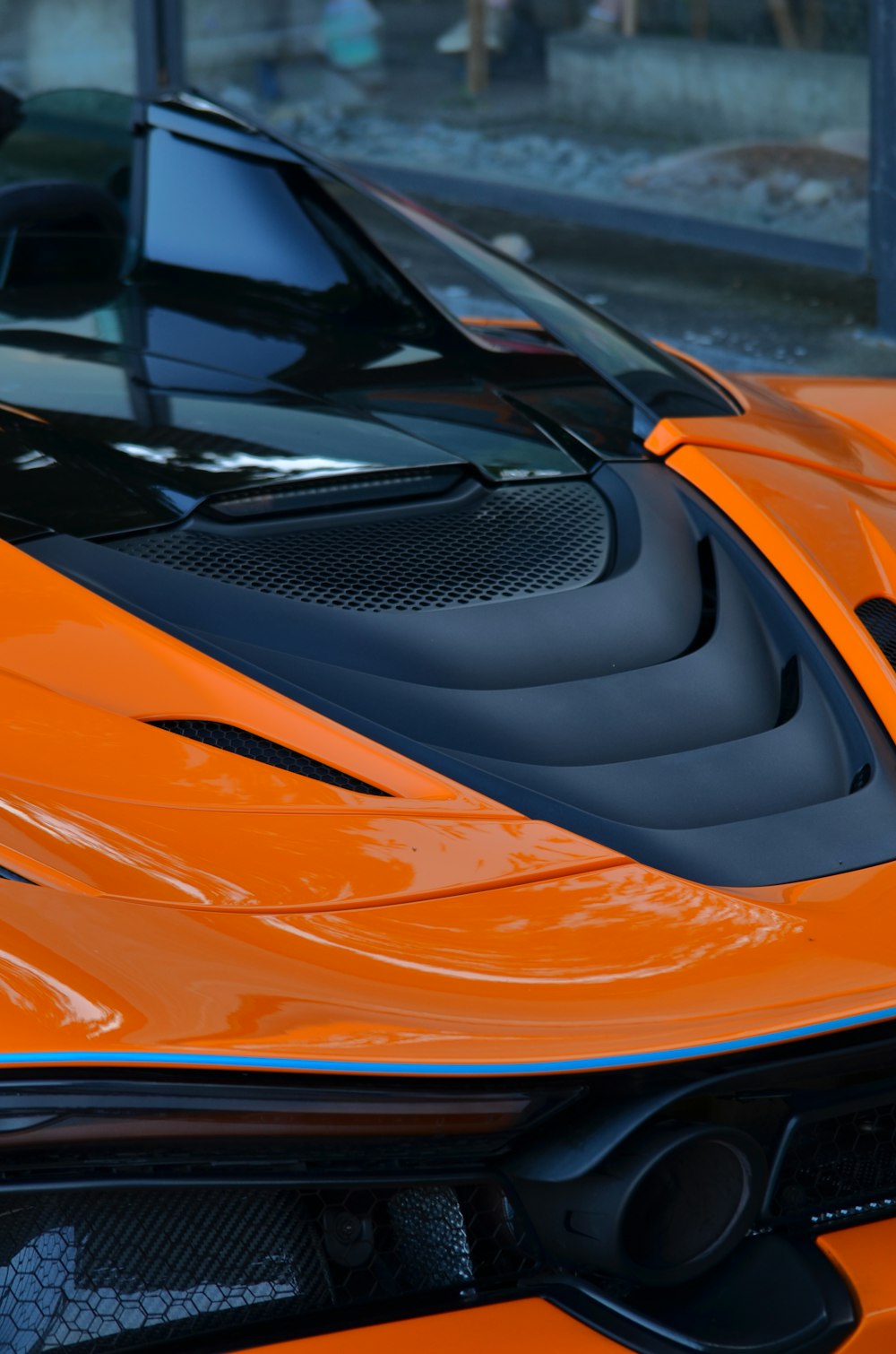 a close up of an orange sports car