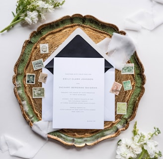 a wedding stationery with a black and white envelope