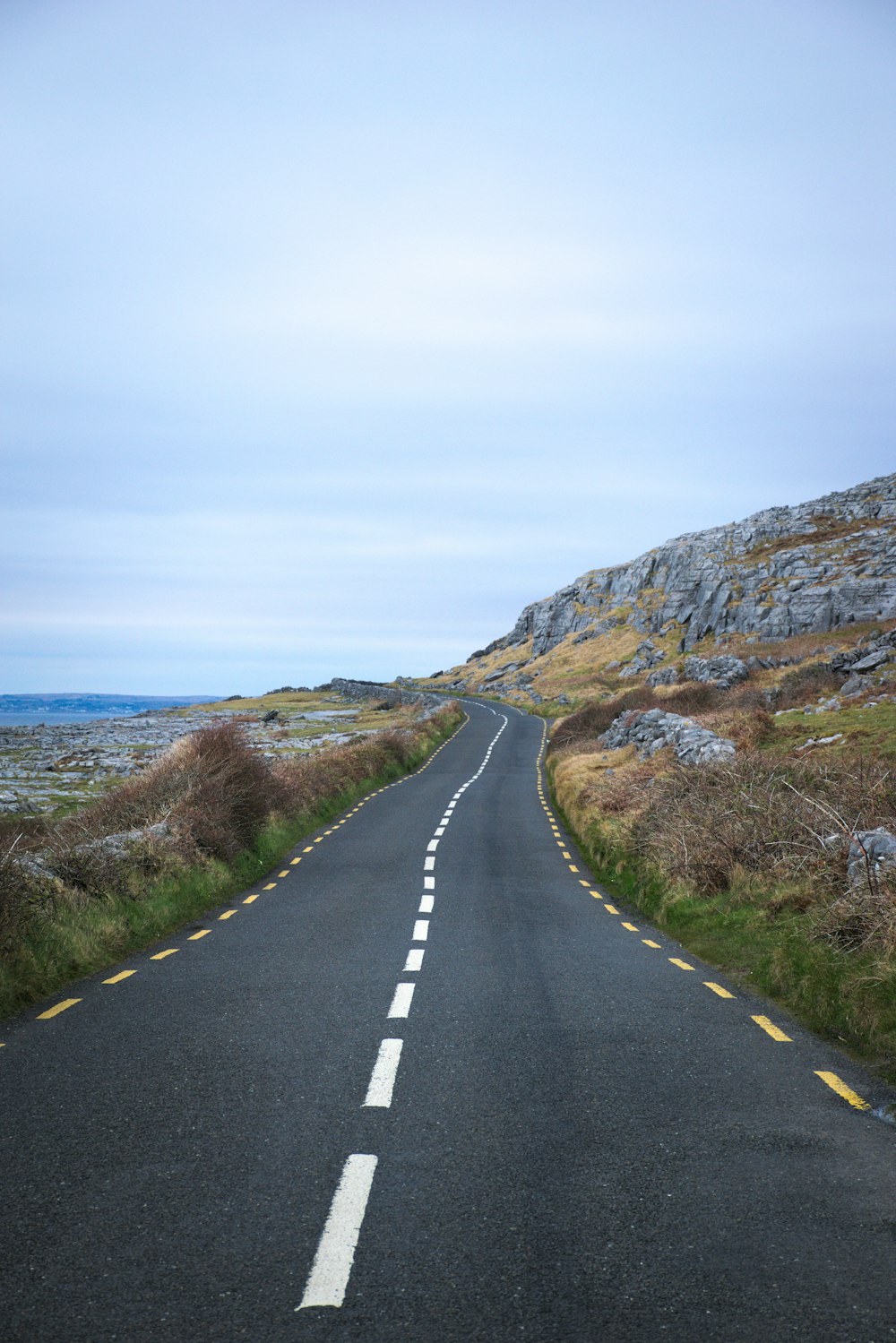 an empty road in the middle of nowhere