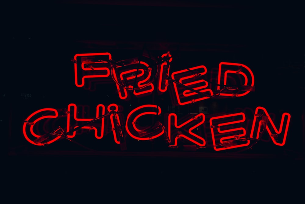 a neon sign that says fried chicken on it