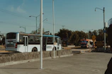 Rumbofiel transport vehicles lined up ready for daily routes under a clear sky
