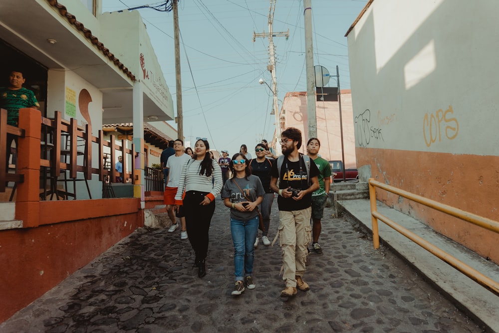 a group of people walking down a street