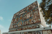 Colorful mural showcasing themes of creativity and design at a university venue in Nayarit.