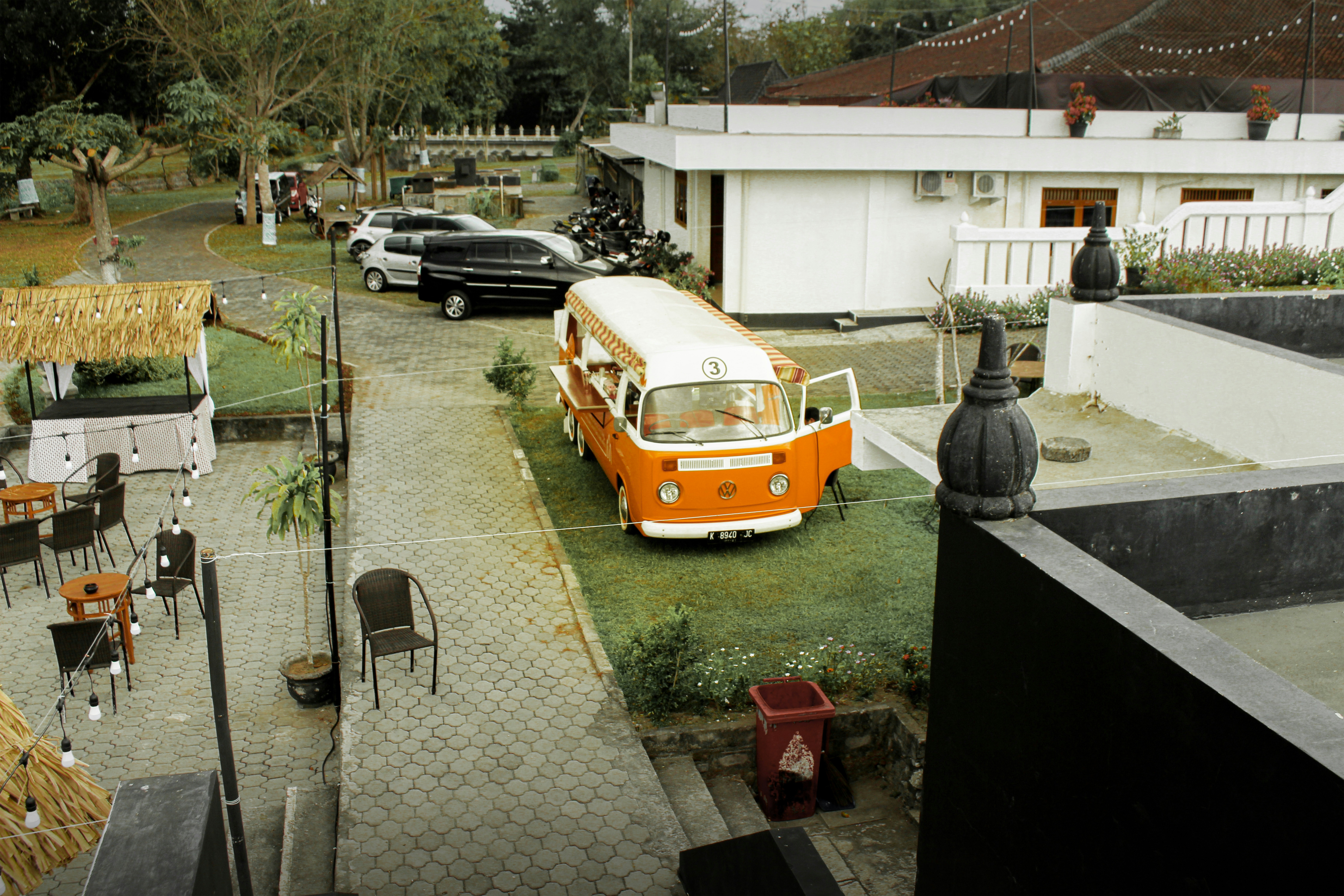 Ford F-150 Lightning charging on a wall-mounted home charger inside a modern garage