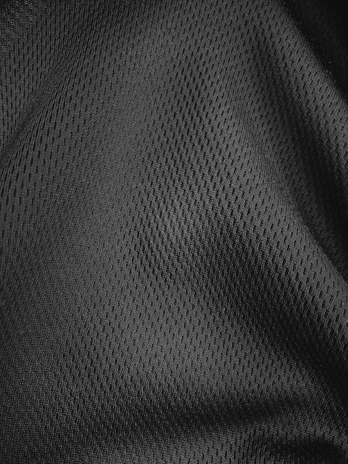 a close up view of a black polyester fabric