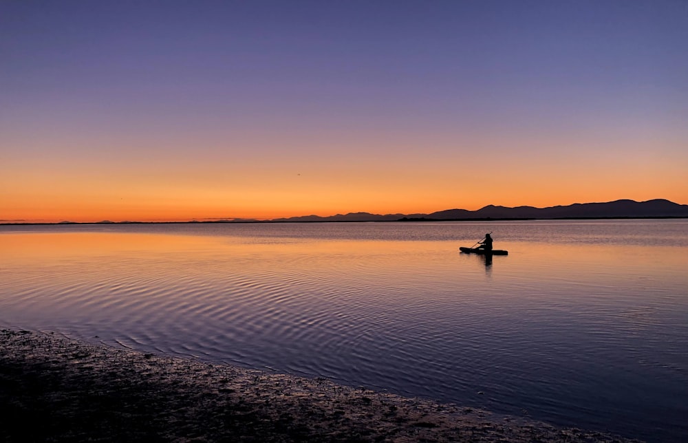 a person in a boat on a body of water