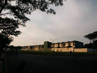 a row of houses sitting on the side of a road