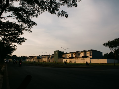 a row of houses sitting on the side of a road