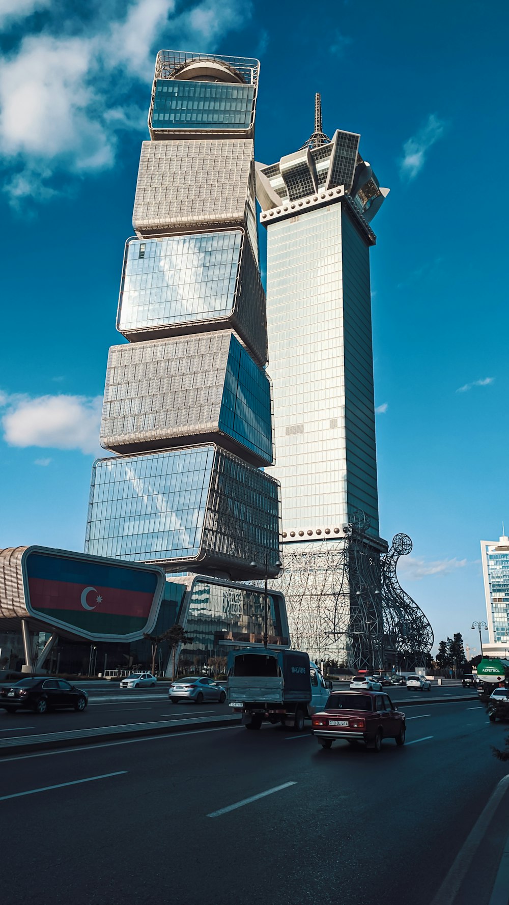 a very tall building sitting on the side of a road