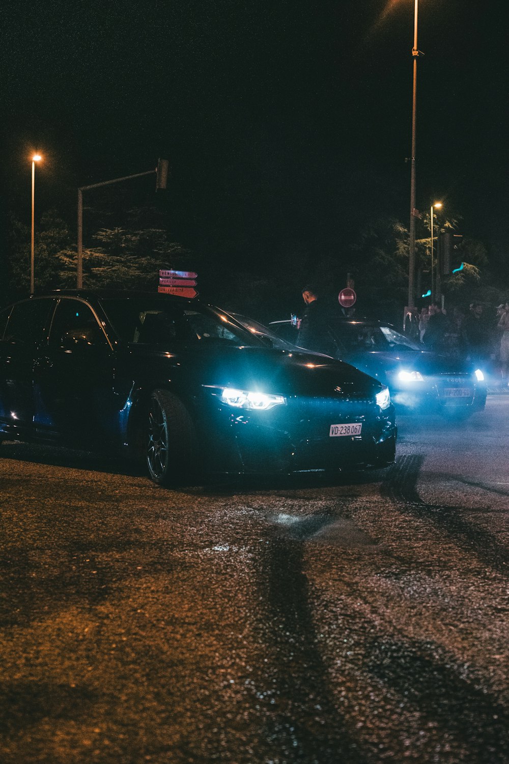 a couple of cars that are sitting in the street