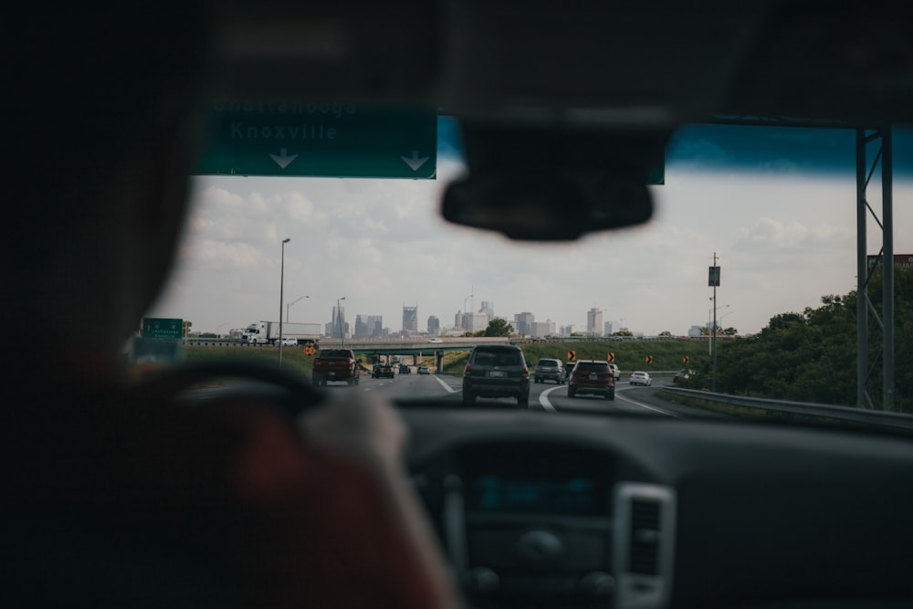 a view of a city from inside a car