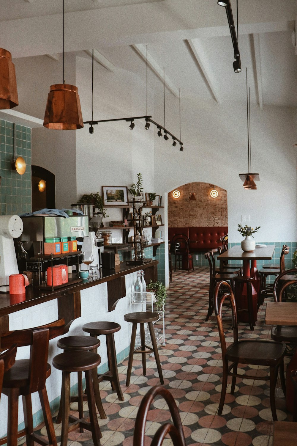 a restaurant filled with lots of tables and chairs