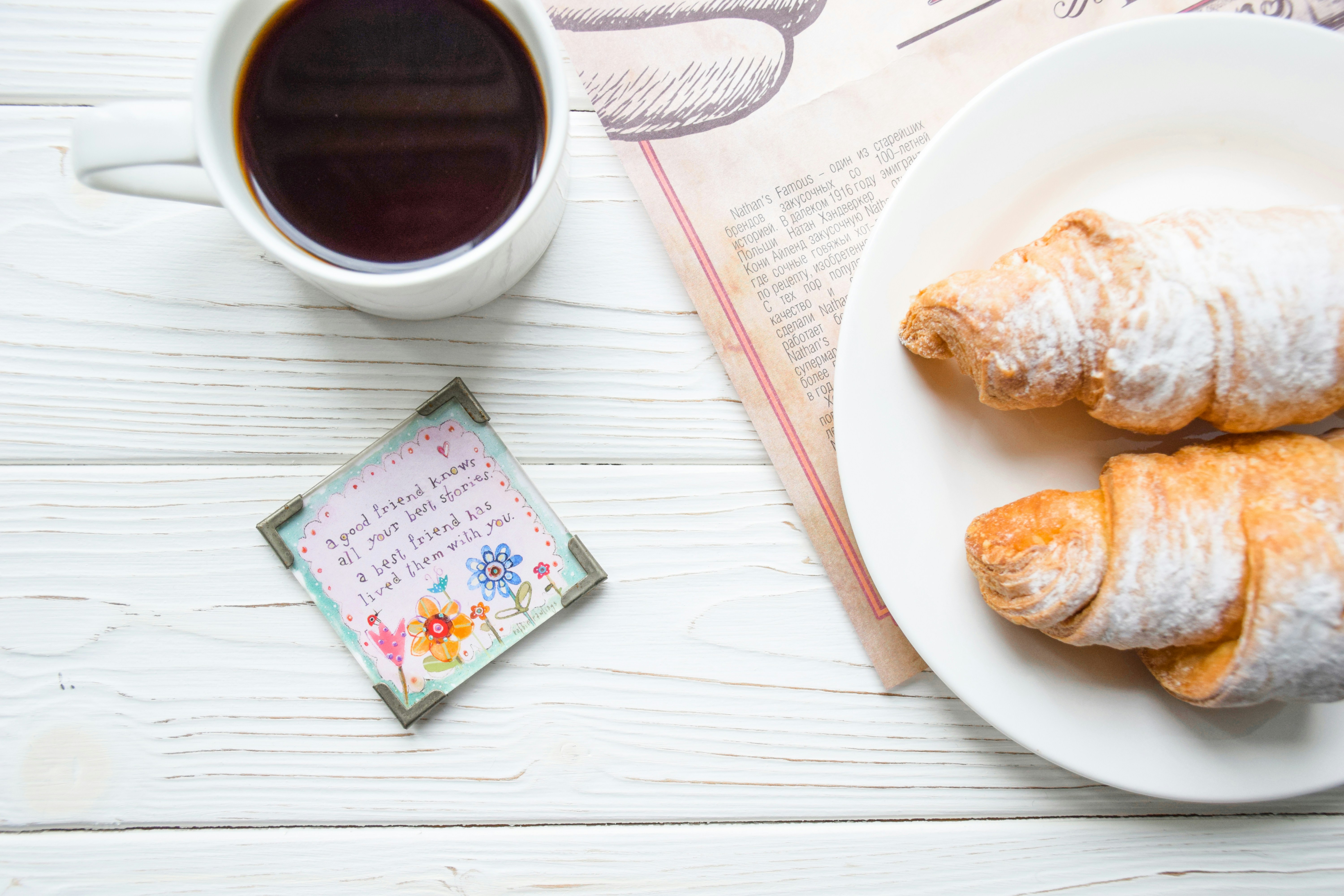 Sugar-dusted croissants with black tea
