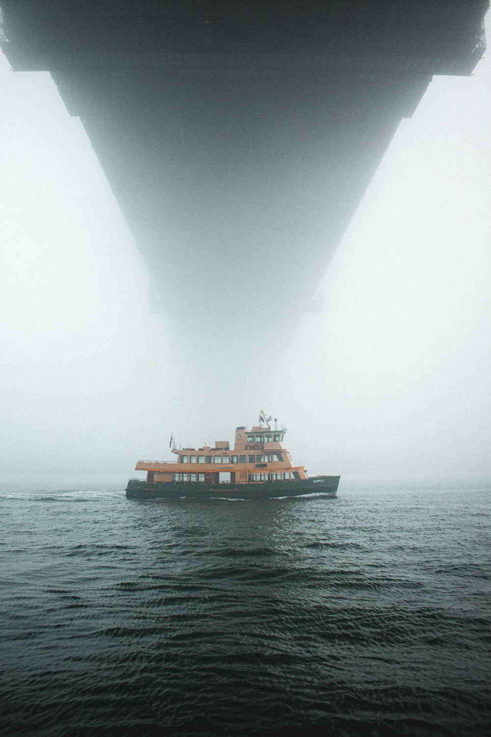 a large boat floating on top of a body of water