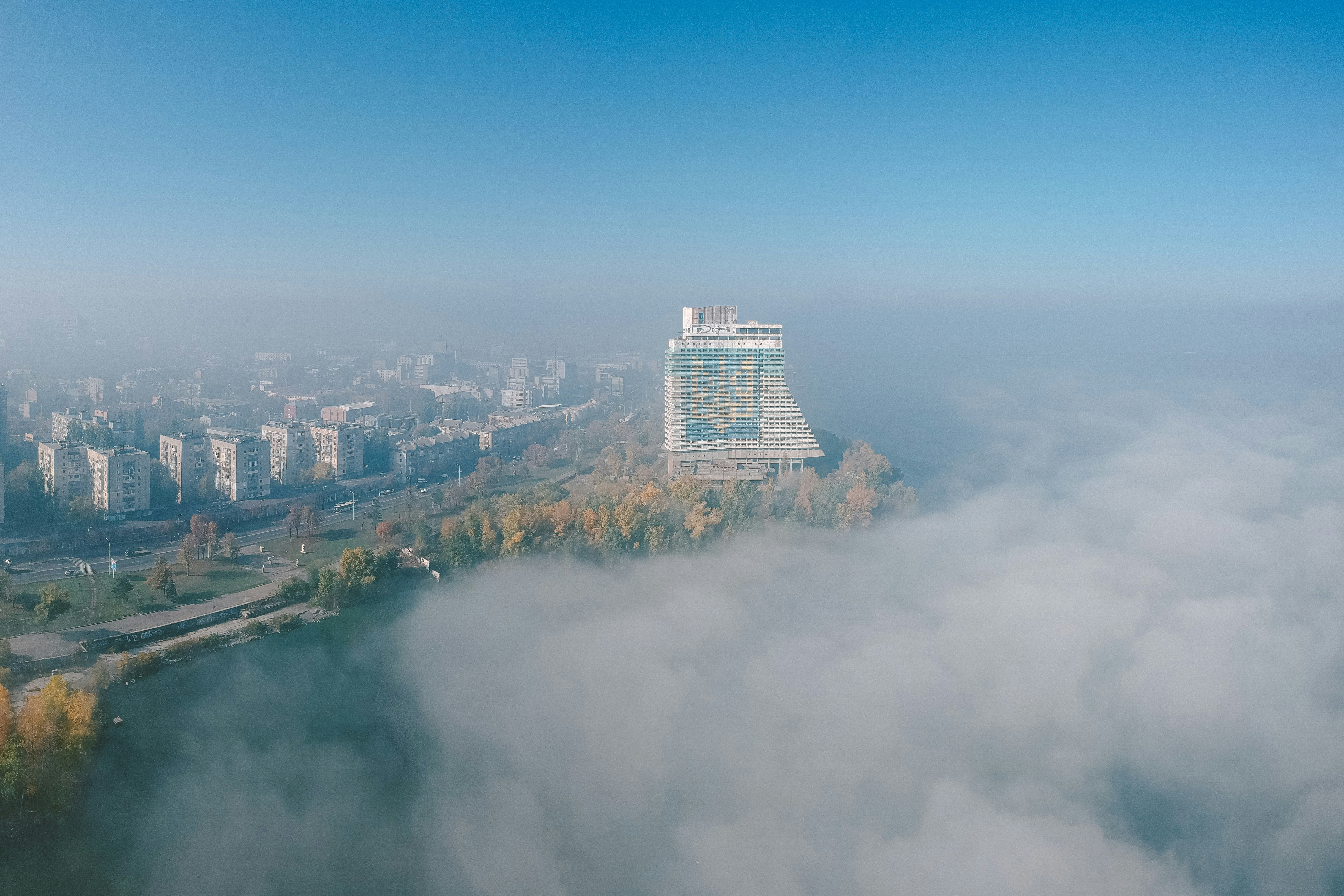 an aerial view of a city in the clouds