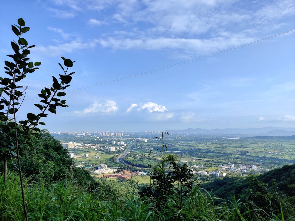 a view of a city from the top of a hill