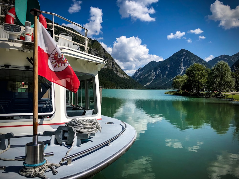 a boat with a canadian flag on the front of it