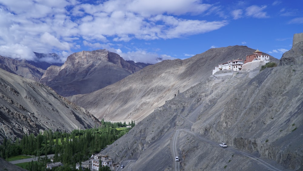 a view of a mountain with a house on top of it