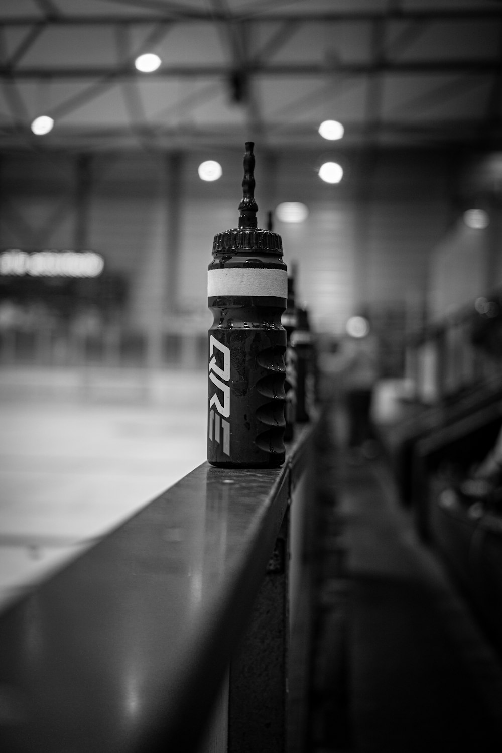 a black and white photo of a can of soda