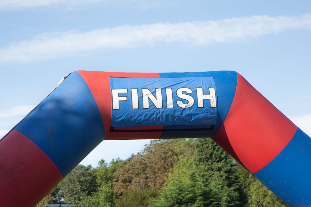 a large inflatable arch with the word finish on it