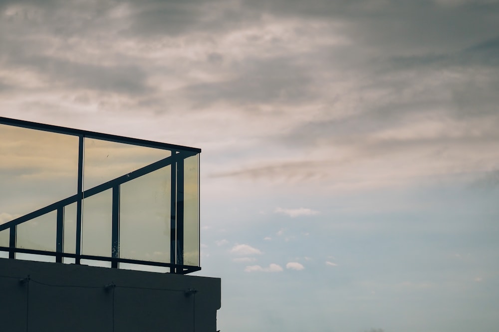 a tall building with a glass window on top of it