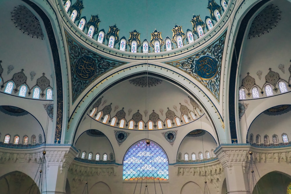 the inside of a building with a blue ceiling