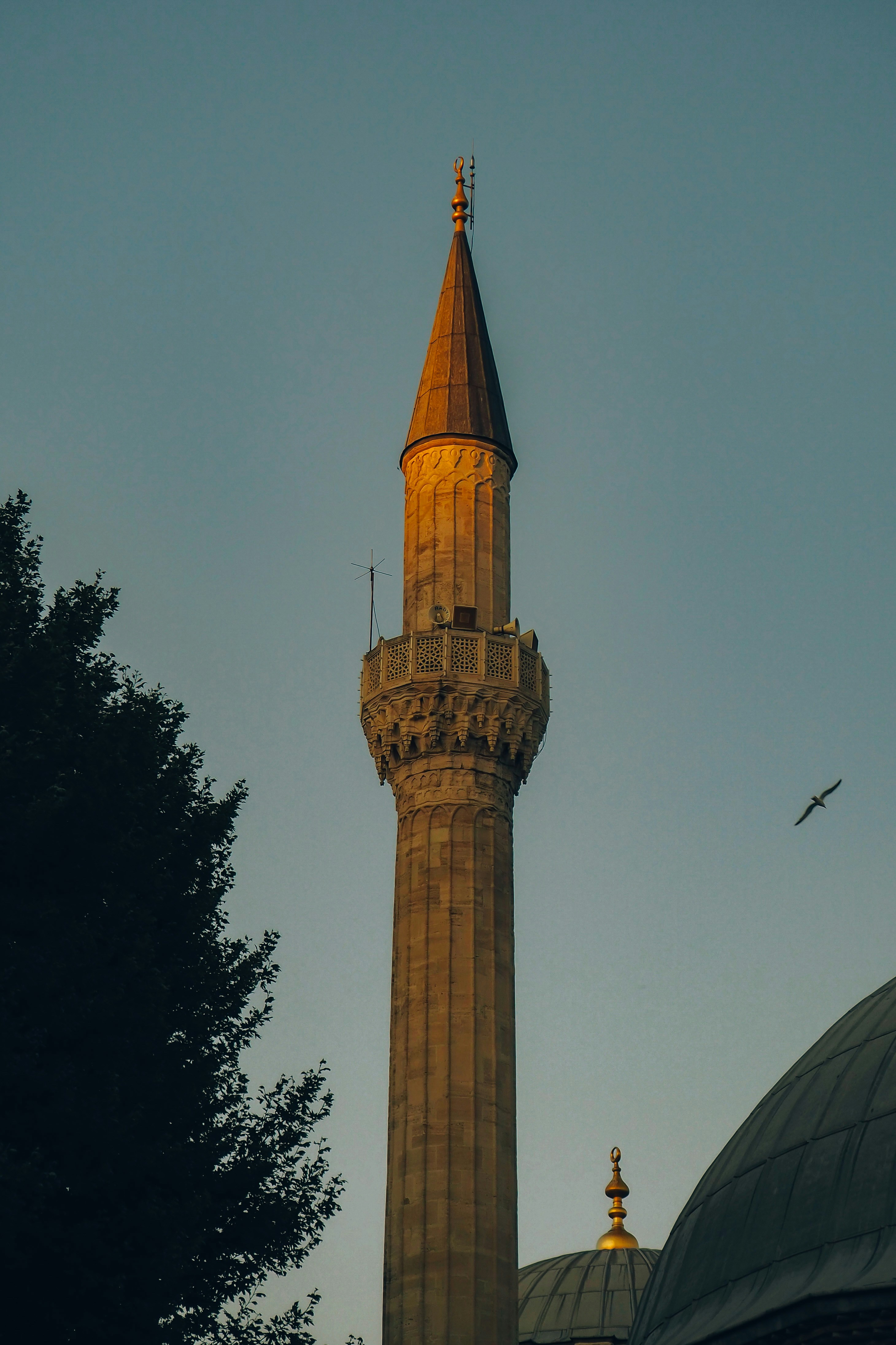a tall tower with a clock on the top of it