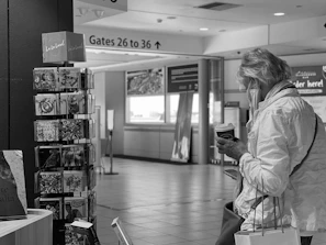 A traveler relaxing with a cup of coffee while waiting comfortably at the airport