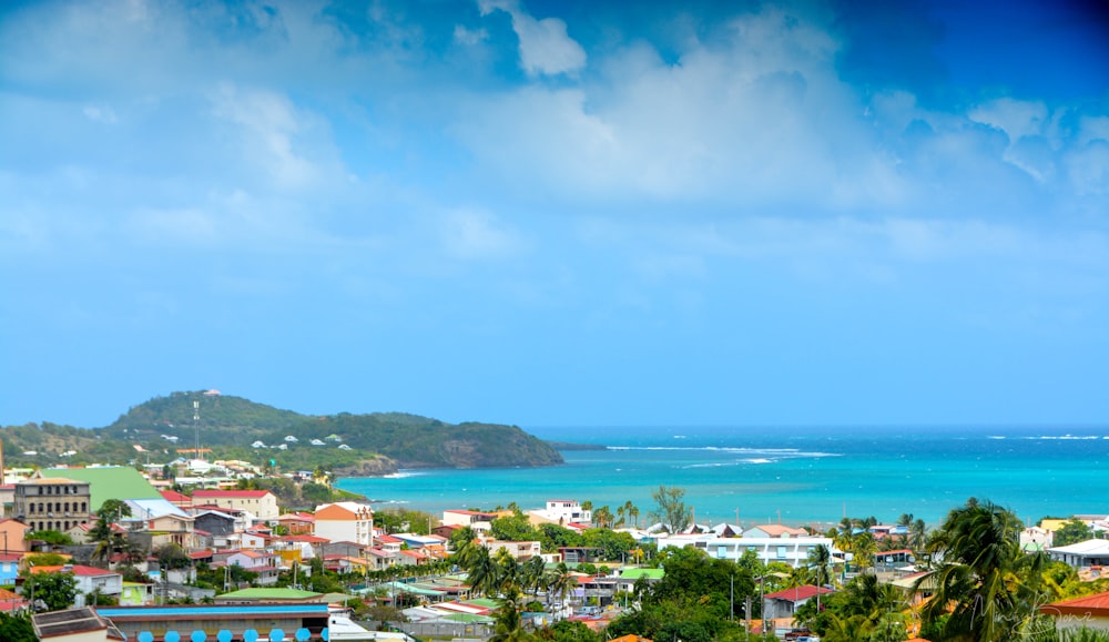 a view of a city with a body of water in the background