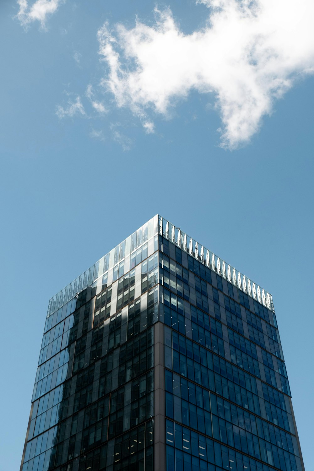 a very tall building with a sky background