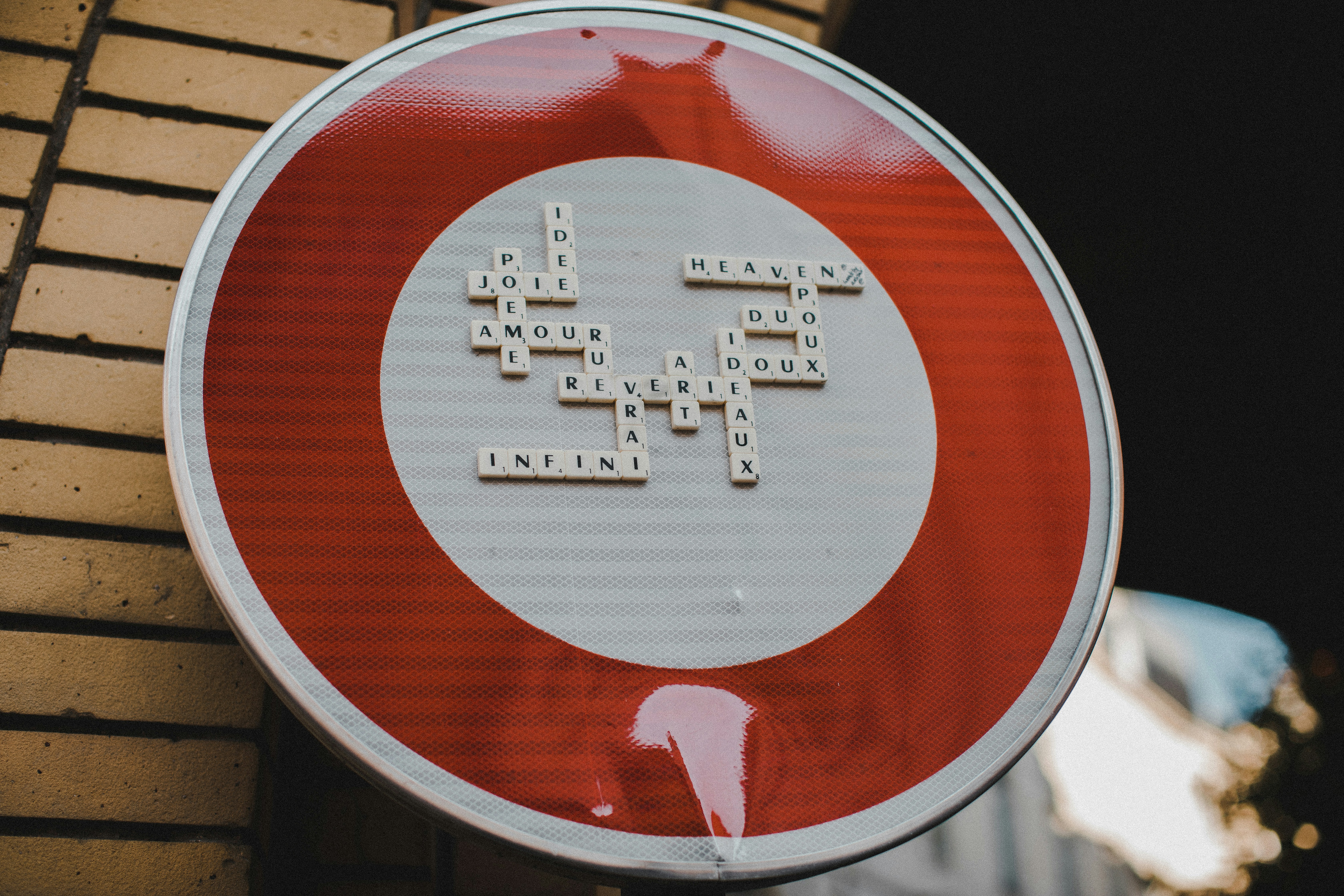a close up of a street sign with a building in the background