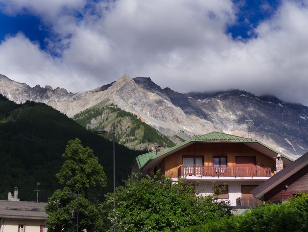 a house with mountains in the background