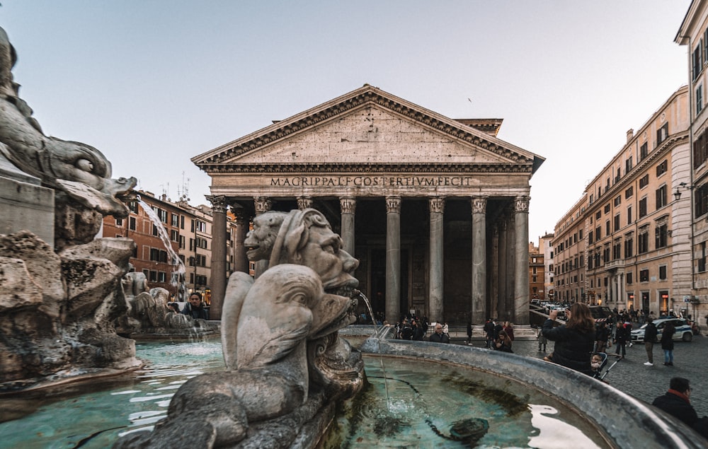 a large stone statue in front of Pantheon, Rome